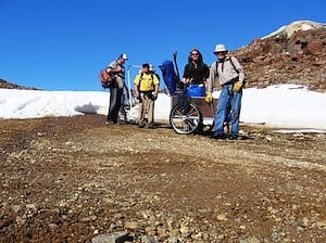 surveyors-smile-after-towing-survey-gear-up-snow-covered-mountain-on-baffin-island-nunavut