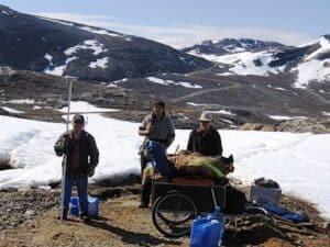 surveyors-pose-at-the-top-of-baffin-islands-cape-hopper