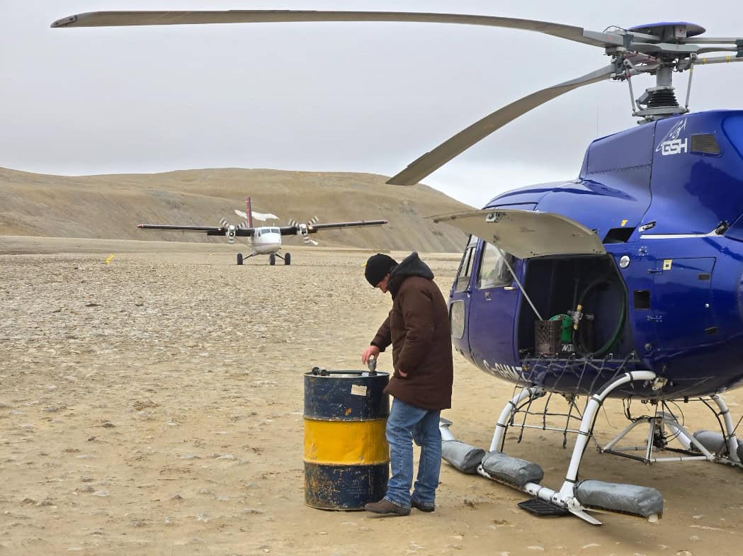 Refueling helicopter at storm camp nunavut